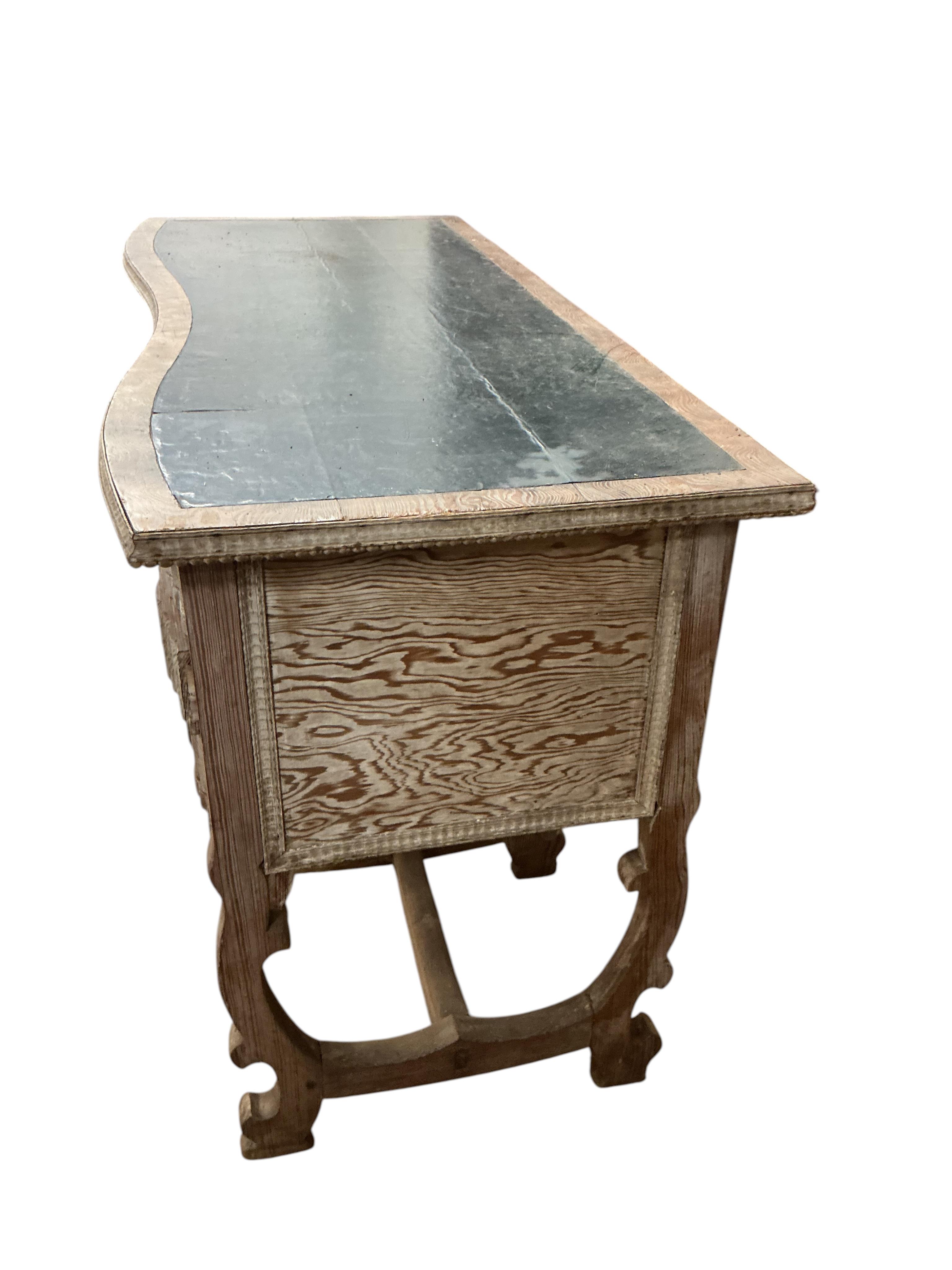 An early 20th century Continental bleached oak kneehole desk, width 122cm, depth 56cm, height 78cm